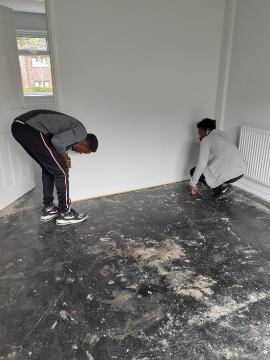 Helping each other decorate/measure: sense of community & taking ownership